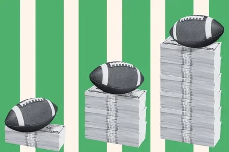 Footballs sit atop stacks of paper money