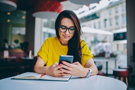 A woman looks at images of social media platforms in 2010 vs. 2020