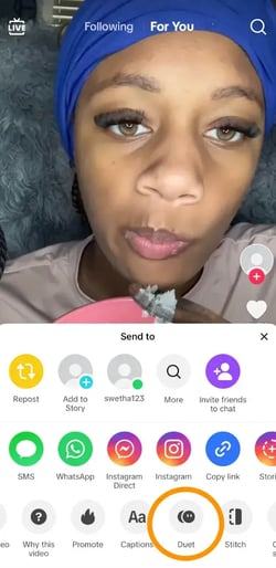 : Click the Share button on a video to access the Duet feature.