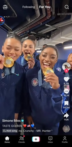 : Simone Biles TikTok of the U.S. Womens Gymnastics team pretending to eat their gold medals.