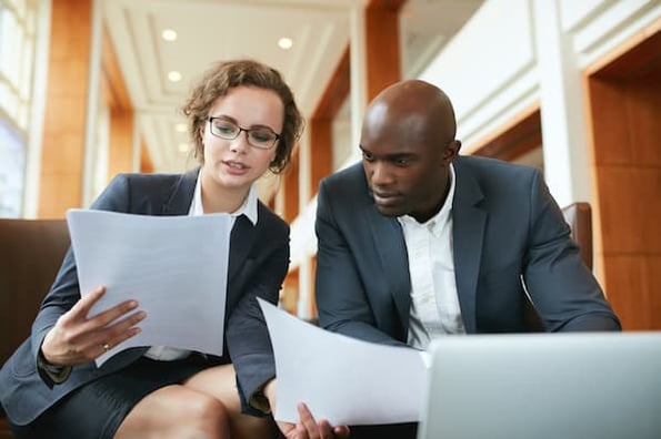 businesspeople working together to valuate their company