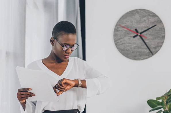 A person checks the time to be mindful of teammates in different timezones.