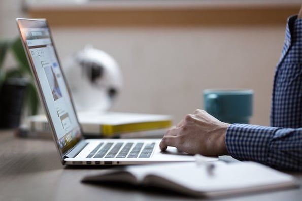 Woman adding alt text to an image on a webpage