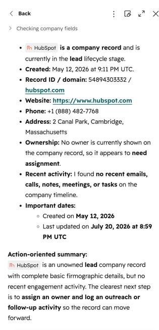 A HubSpot Breeze Assistant chat interface summarizing the HubSpot company profile, displaying details like employee count, address, assigned owner, contact info, and recent engagements.