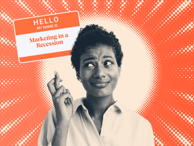 a hubspot-branded featured image of a woman crossing her fingers while looking up at a nametag that says marketing in a recession