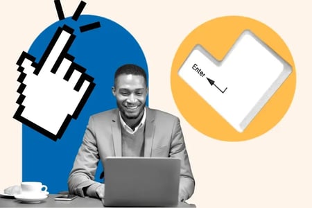 man using a laptop and smiling