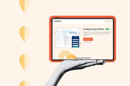 Hand holds a tablet showing HubSpot's landing page builder