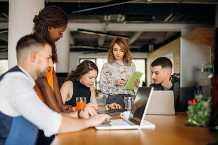 marketing team determining whether a brand refresh or rebrand is best for the company
