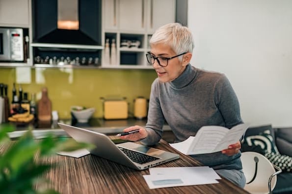 businessperson calculates monthly recurring revenue