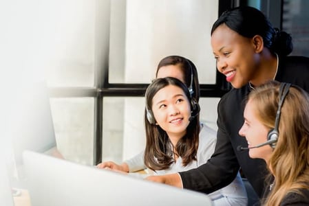 sales manager using sales training manual to prepare new hires