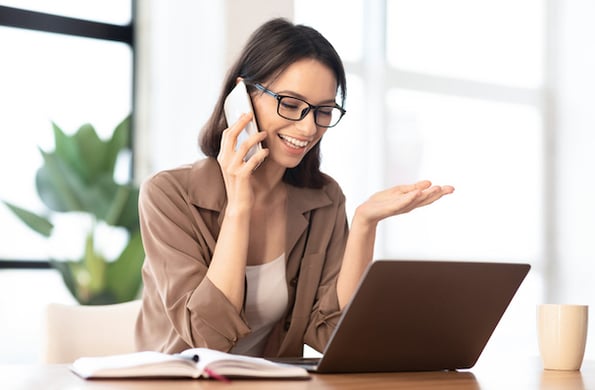 discussing a nonprofit newsletter strategy on a phone call