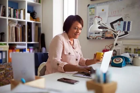 email marketer creating an opt-in email on laptop