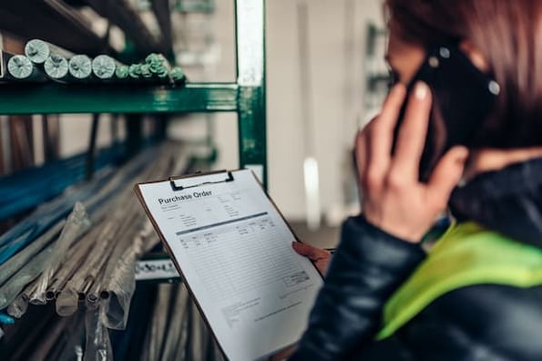 vendor looking over a purchase order