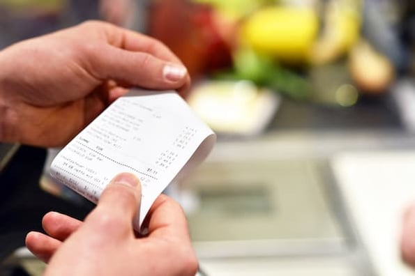 shopper ready to use a receipt scanner