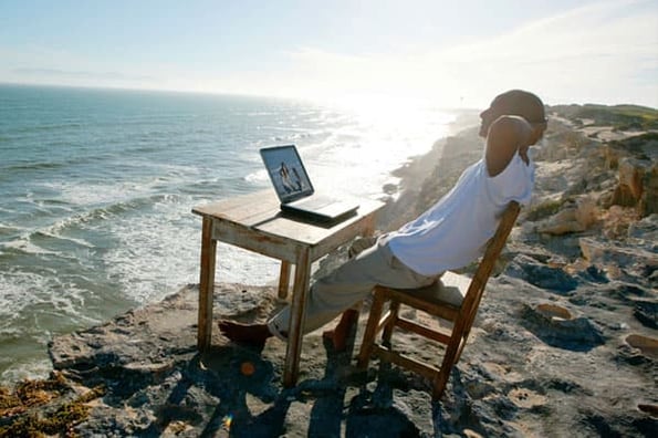 a person highlights a remote work myth that people work on the beach.