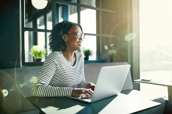 Woman enjoying her remote workspace.