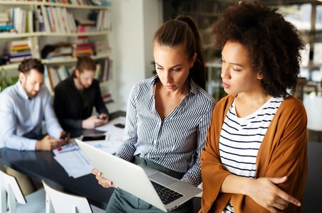 salespeople creating a report that displays their business sales performance