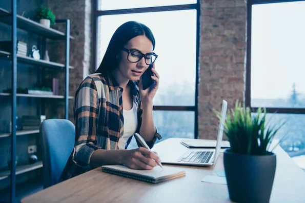 Saleswoman moves along a prospect from an MQL to an SQL