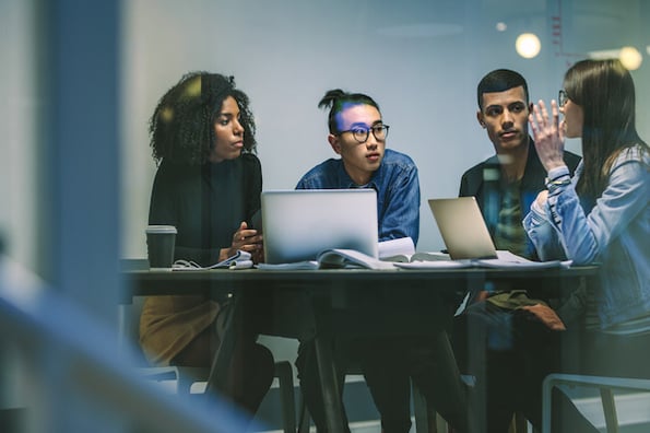 Marketing team choosing a free SEO keyword tool.