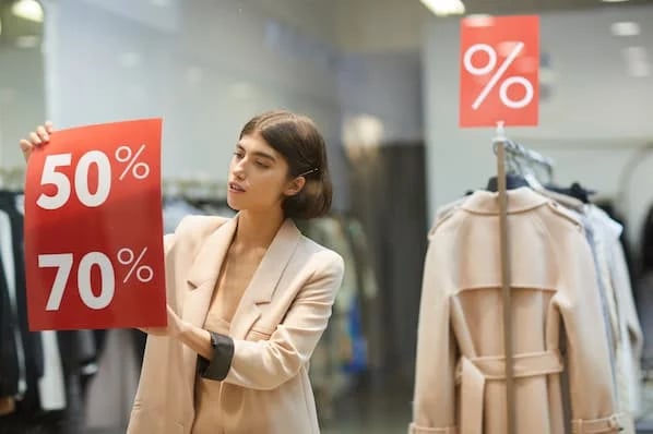 Shop owner implementing a discount strategy