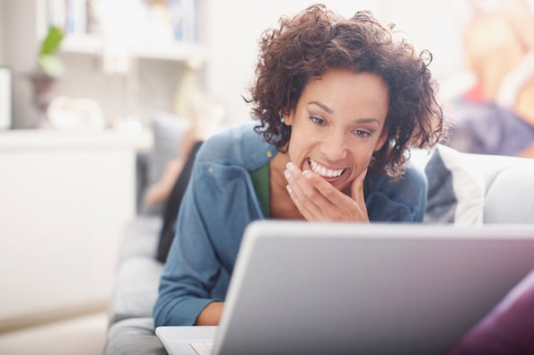 Woman designing website navigation with a laptop