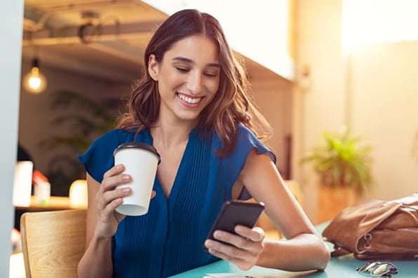 marketer reading tips for writing good email subject lines on their phone