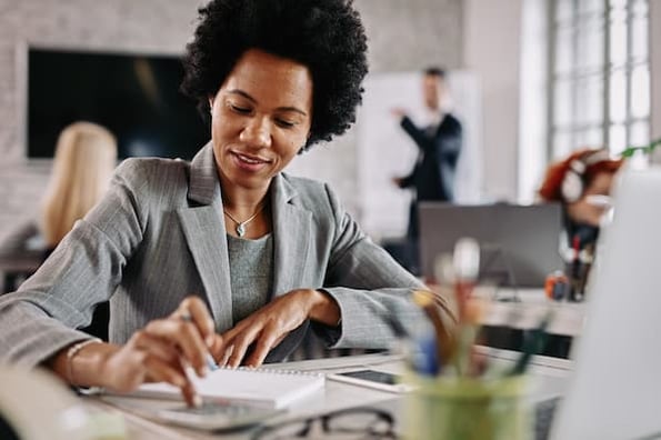 Salesperson calculating the value-based price of her products and services