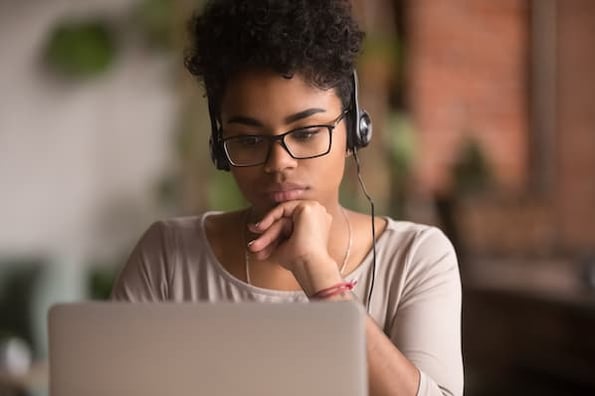 sales rep listens to a session during virtual sales conference