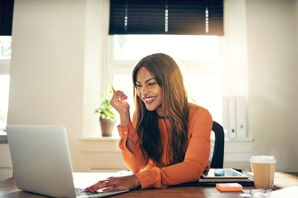 woman-laughing-at-computer