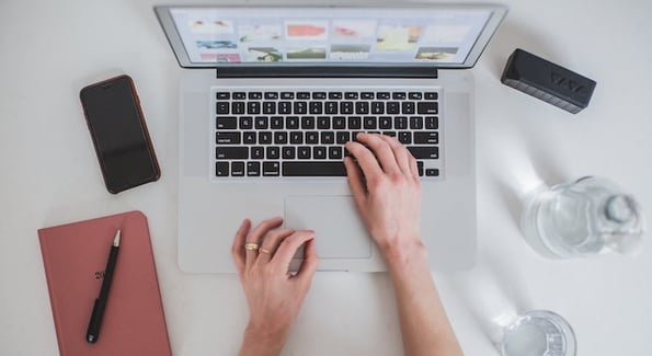 womans-hands-typing-laptop-1