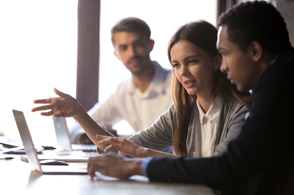 businesspeople using a computer and talking about WordPress security issues