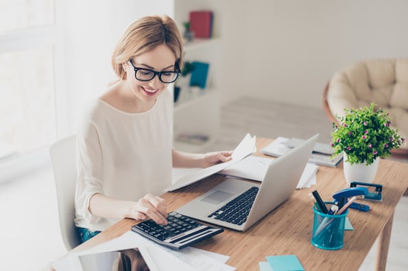 Person calculating the cost of a WordPress website cost