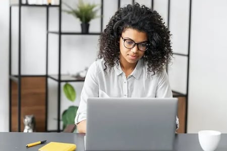 Woman installing WordPress timeline plugin