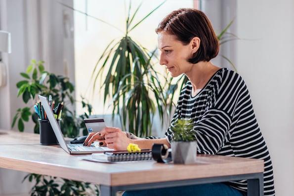 woman using a laptop computer to track user activity in WordPress