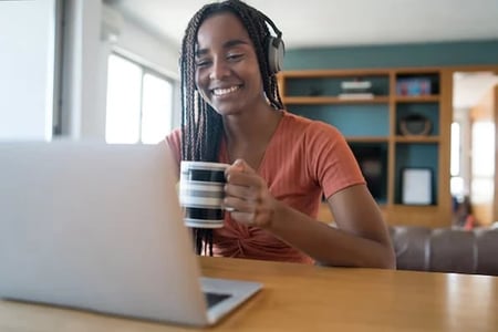 Marketer watches a video on her laptop