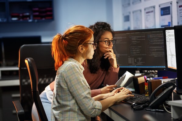 two people using a computer to implement API security