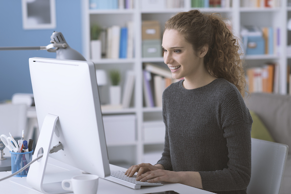 businessperson using a computer to install WordPress on Bluehost