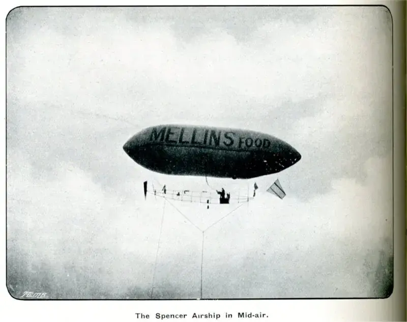 Photo of a blimp with Mellins Food on the side.