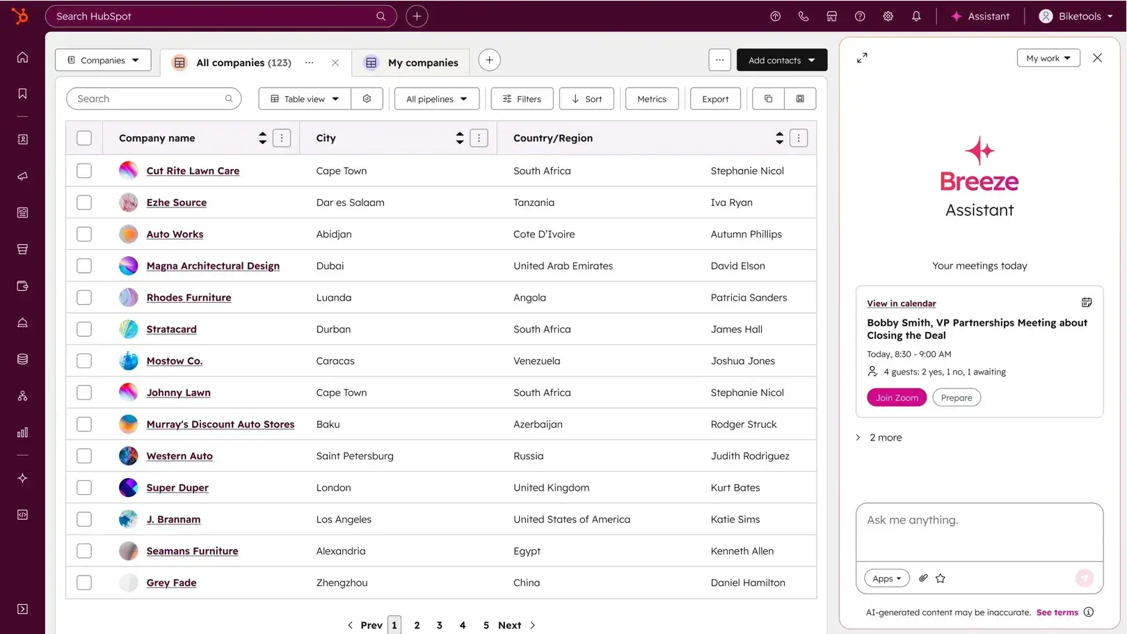 sales engagement platform vs CRM dashboard showing HubSpot Smart CRM company records and Breeze Assistant
