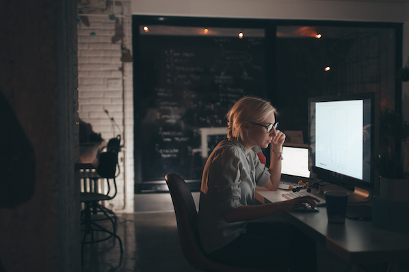 person learning api architecture on a computer in an office