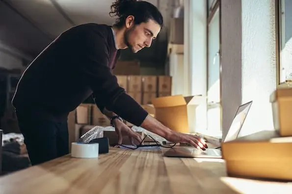 man researching best domain registrars 