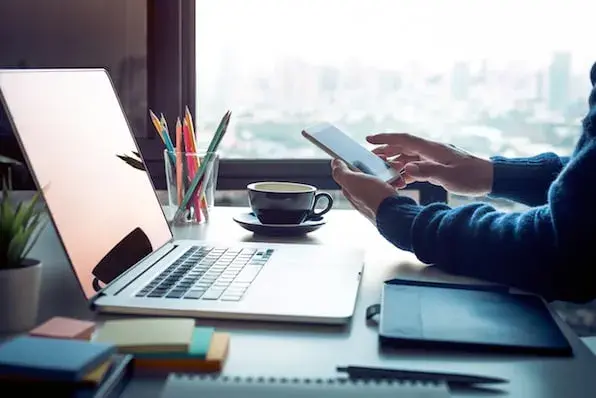 A laptop on a desk.