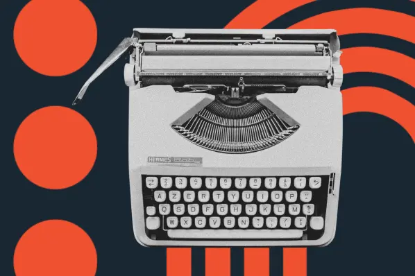 image shows a typewriter against a navy blue background 