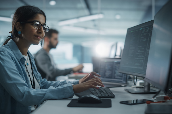 person using google apis on a computer in an office