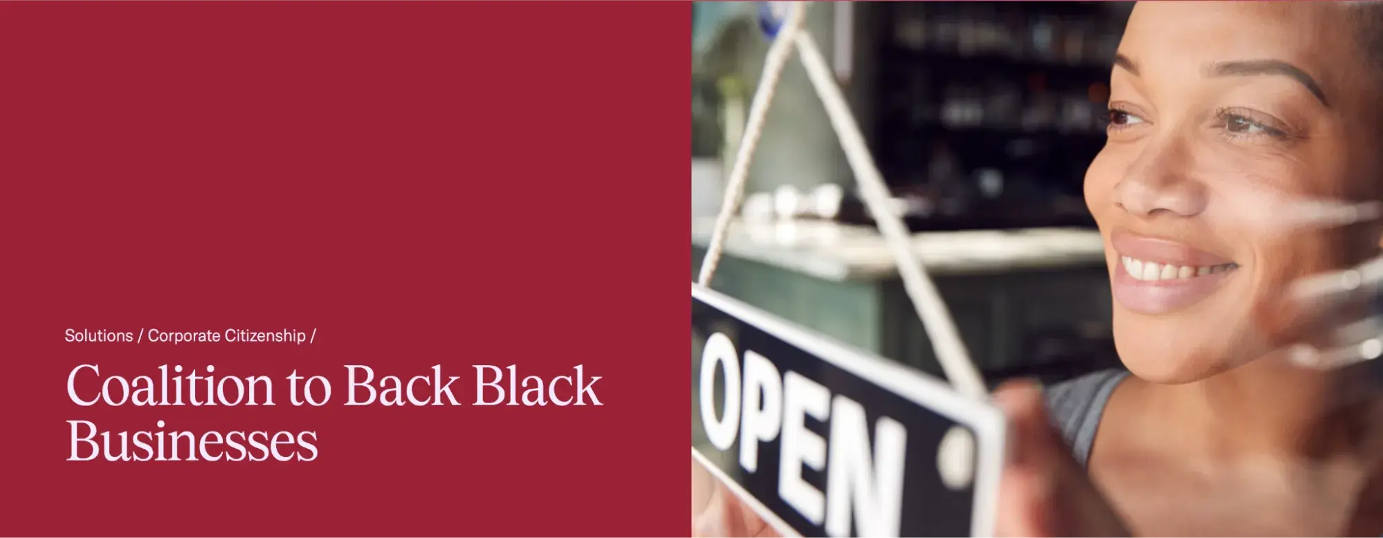 a screenshot of the coalition to back black business homepage with a photo of a black female business owner flipping over an open sign