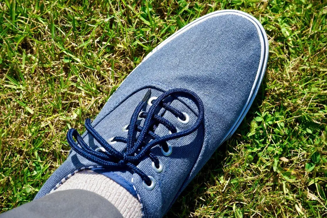 blue sneakers on grass