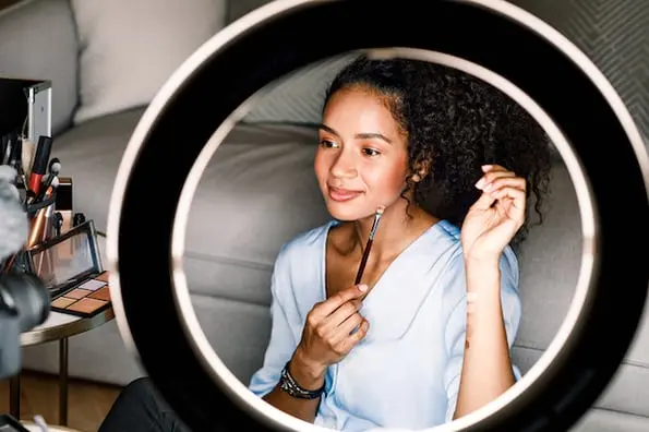 woman on camera with ring light