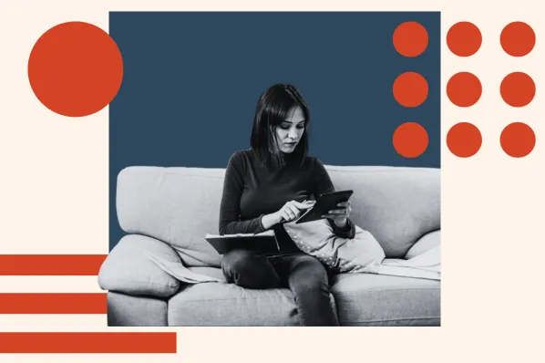 person sitting on couch looking at tablet calculating their survey response rate
