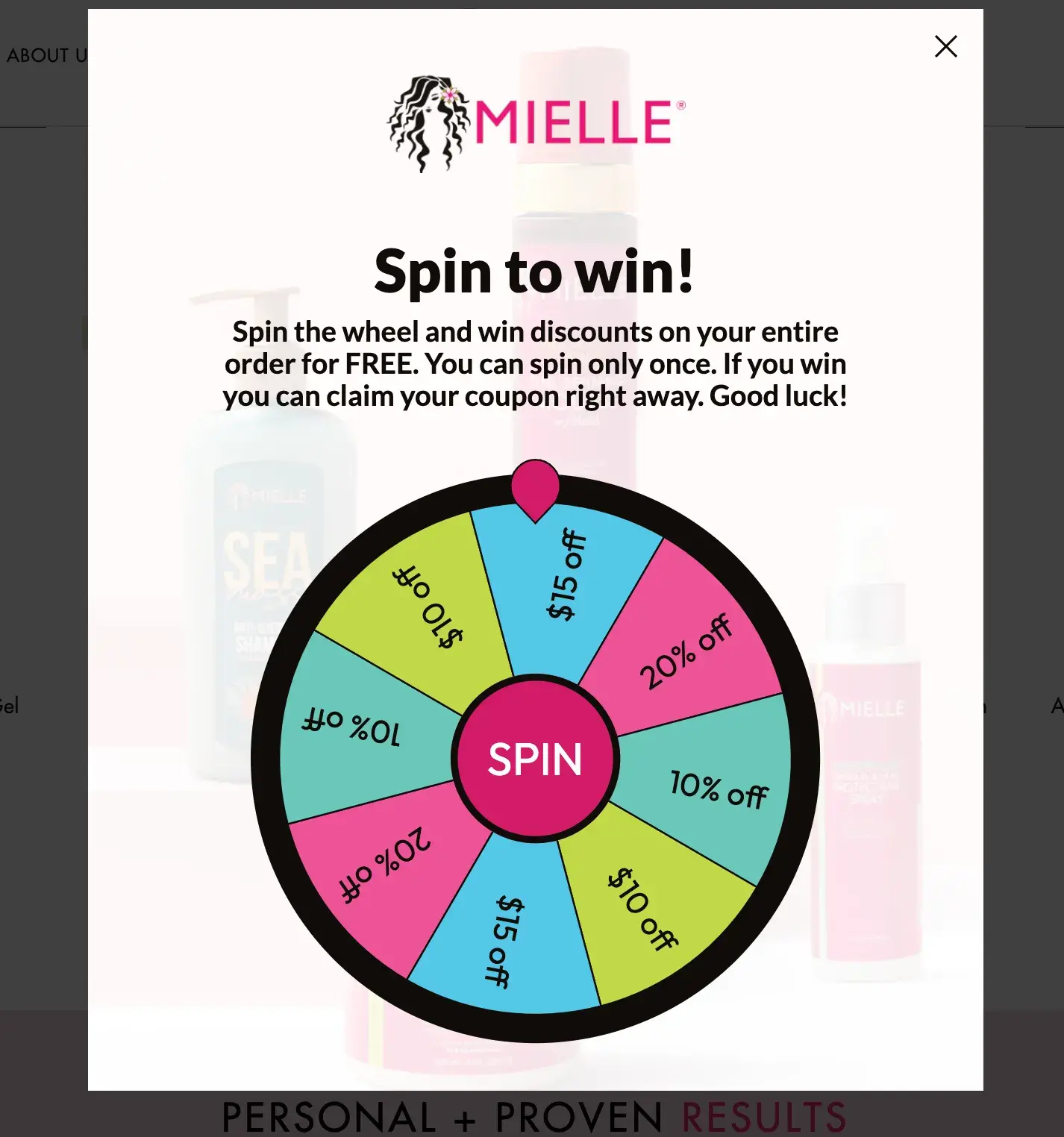 the ui design of the mielle organics website popup showing a “spin to win” option