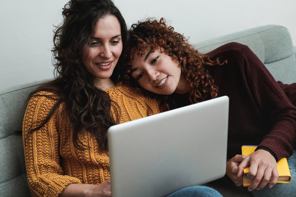 Couple looking at wedding theme WordPress sites 